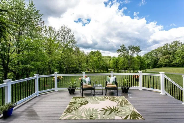 a view of roof deck with furniture