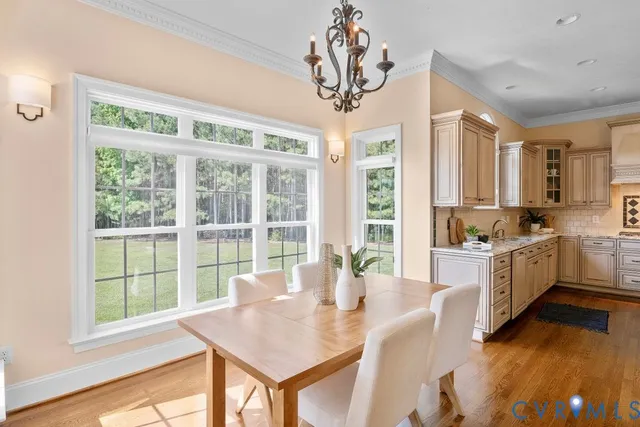 a living room with fireplace furniture and a wooden floor