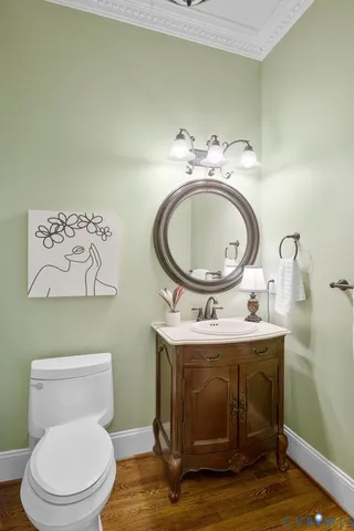 a kitchen with granite countertop a sink a stove and cabinets