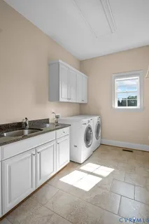 a view of kitchen sink and wooden floor