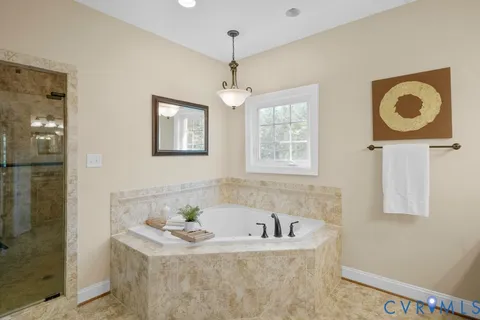 a large kitchen with kitchen island a sink stainless steel appliances and cabinets