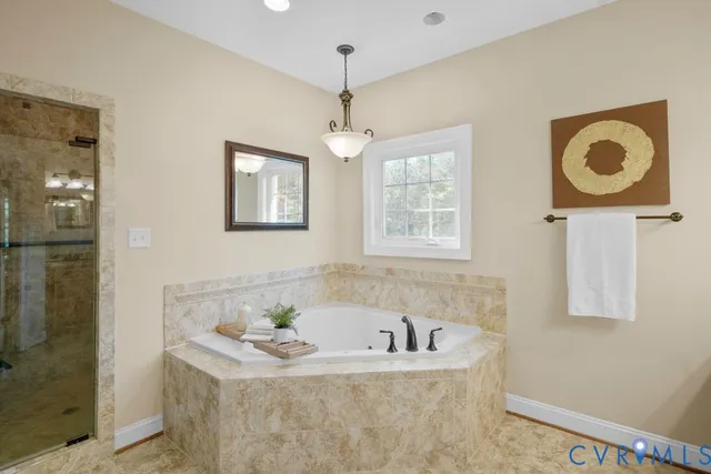 a large kitchen with kitchen island a sink stainless steel appliances and cabinets