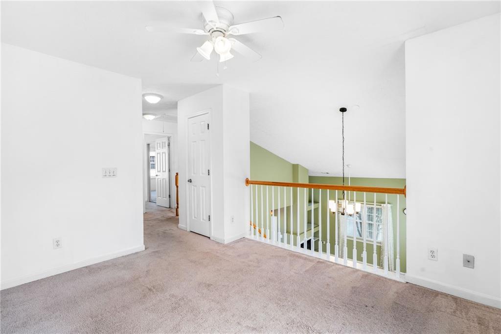 562 Windcroft Circle Northwest Acworth, GA 30101 - Photo 12 of 25 a view of a hallway with a chandelier