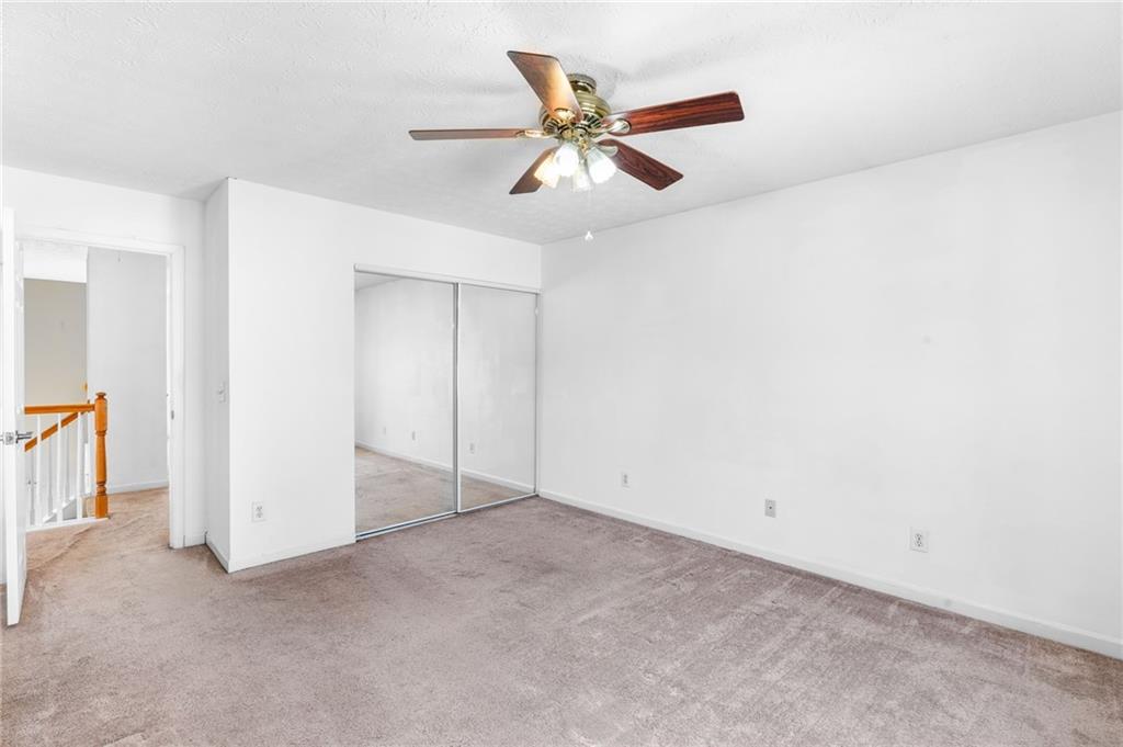 562 Windcroft Circle Northwest Acworth, GA 30101 - Photo 16 of 25 an empty room with closet and fan