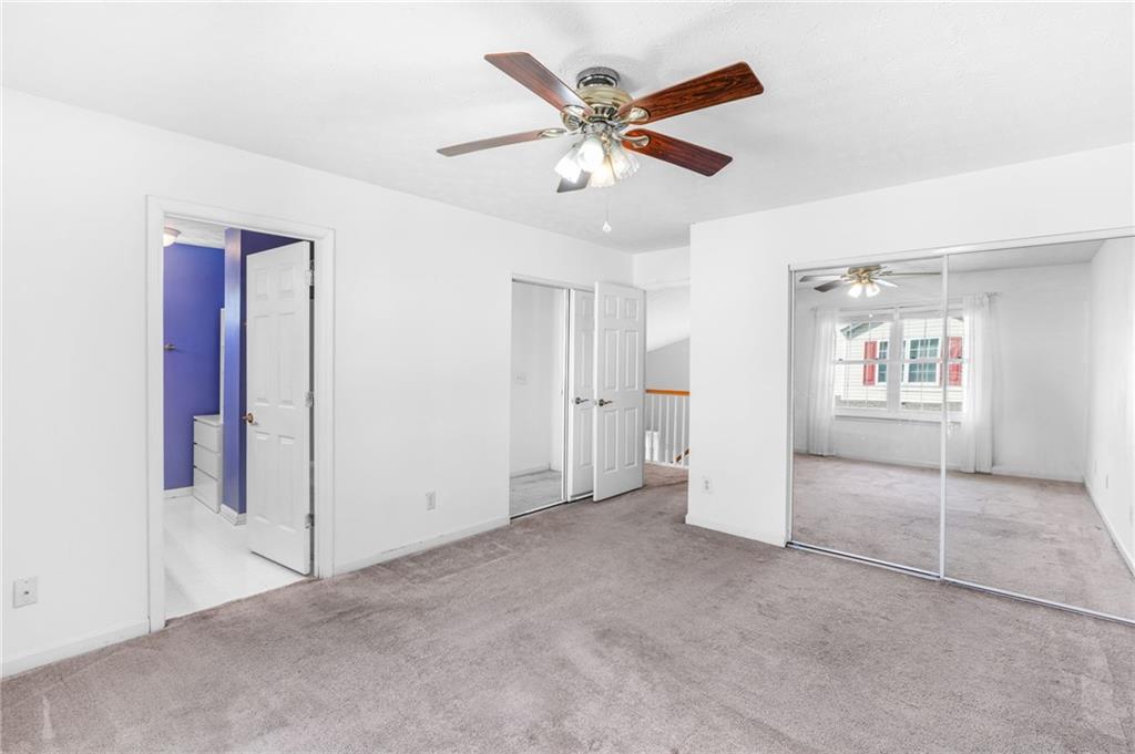 562 Windcroft Circle Northwest Acworth, GA 30101 - Photo 18 of 25 a view of an empty room with a ceiling fan