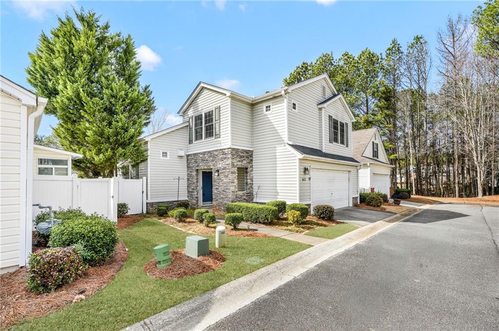 562 Windcroft Circle Northwest Acworth, GA 30101 - Photo 2 of 25 a front view of a house with a yard