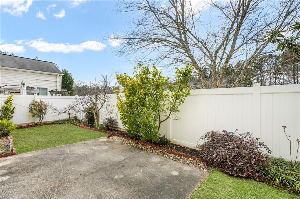 562 Windcroft Circle Northwest Acworth, GA 30101 - Photo 24 of 25 a backyard of a house with lots of green space and trees