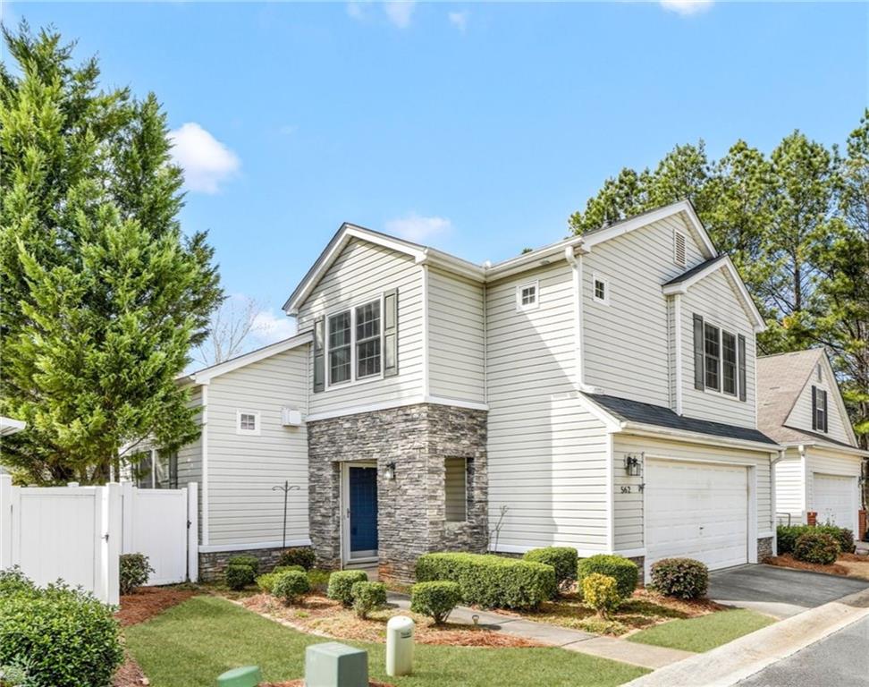 562 Windcroft Circle Northwest Acworth, GA 30101 - Photo 25 of 25 a front view of a house with garden