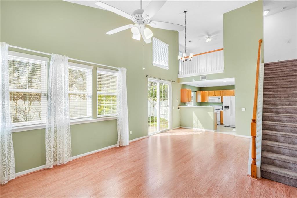 562 Windcroft Circle Northwest Acworth, GA 30101 - Photo 5 of 25 a view of a livingroom with a ceiling fan and window