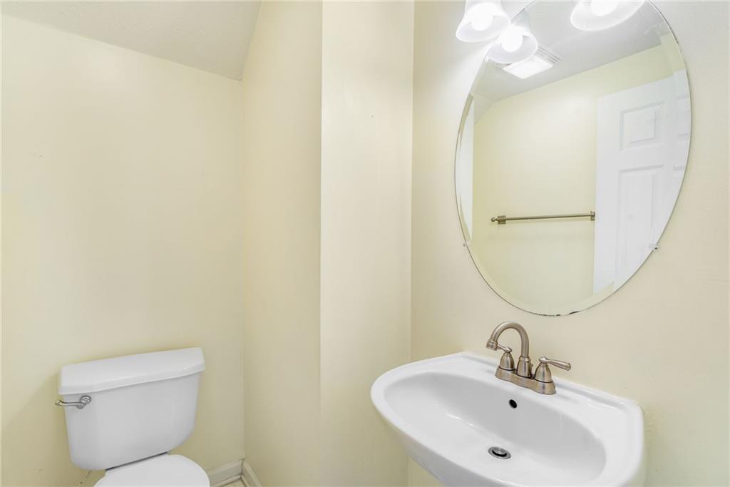 562 Windcroft Circle Northwest Acworth, GA 30101 - Photo 10 of 25 a bathroom with a sink mirror and toilet