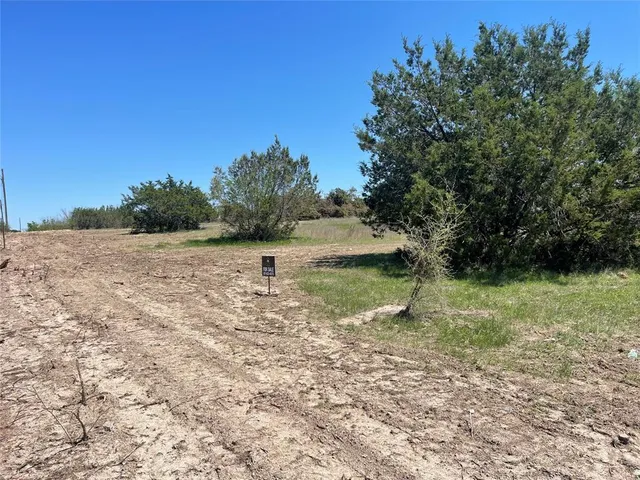 a view of lake with green space