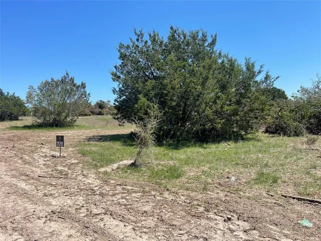 a view of a lake with a yard