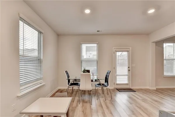 a view of a room with furniture and windows