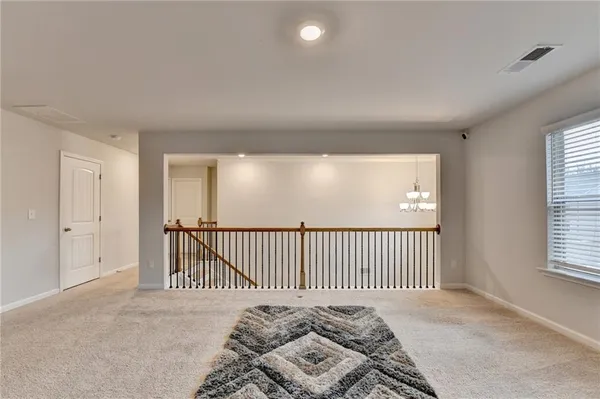 a view of a bedroom with a bed