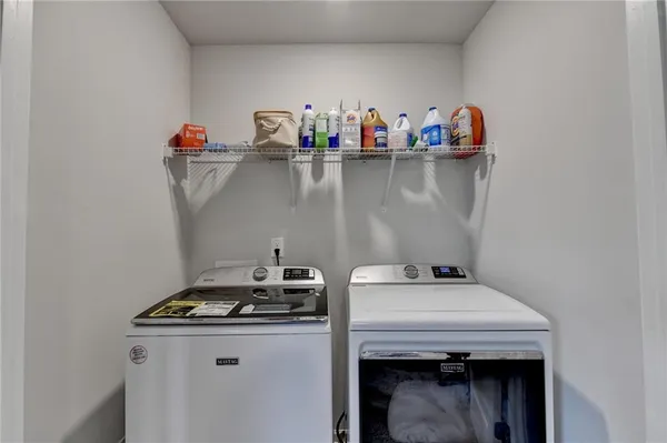 a utility room with dryer and washer