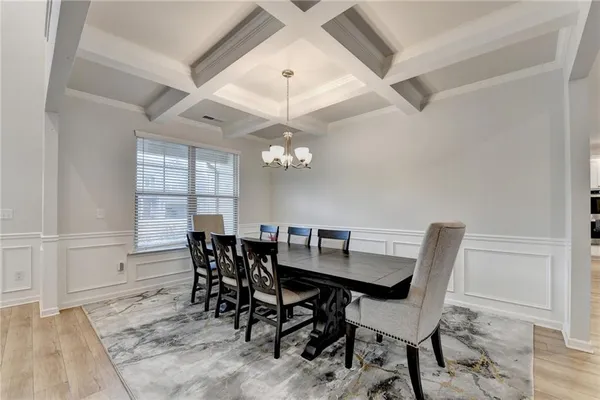a view of a dining room with furniture and window