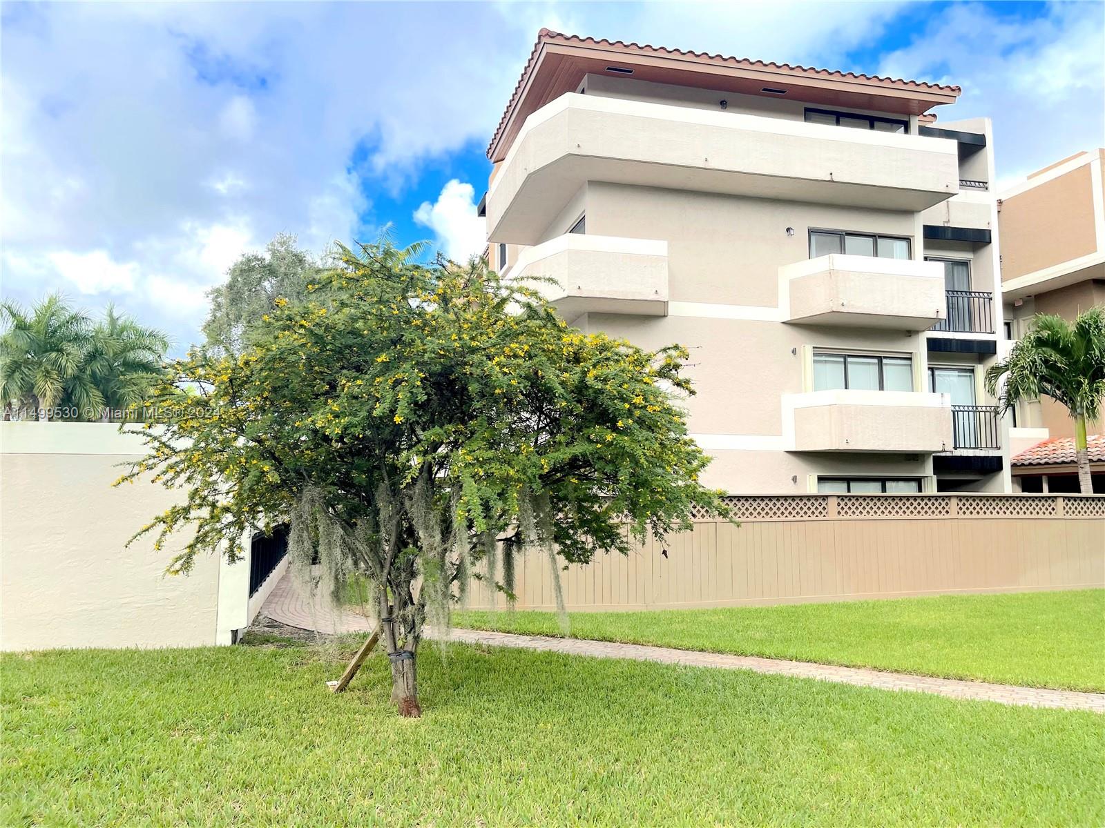 9001 Southwest 94th Street, Unit 201 Miami, FL 33176 - Photo 2 of 10 a house view with a outdoor space