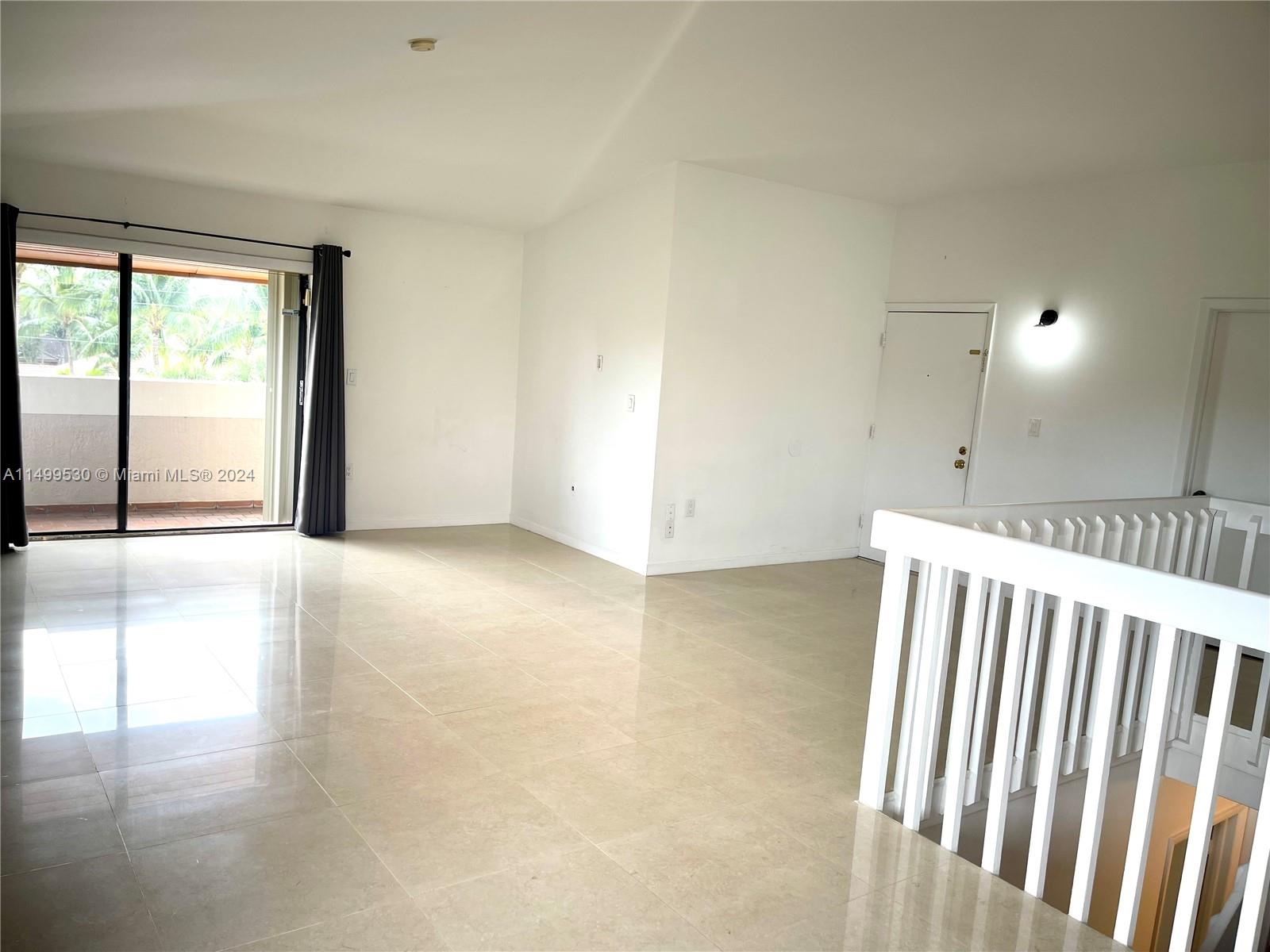 9001 Southwest 94th Street, Unit 201 Miami, FL 33176 - Photo 5 of 10 an empty room with windows