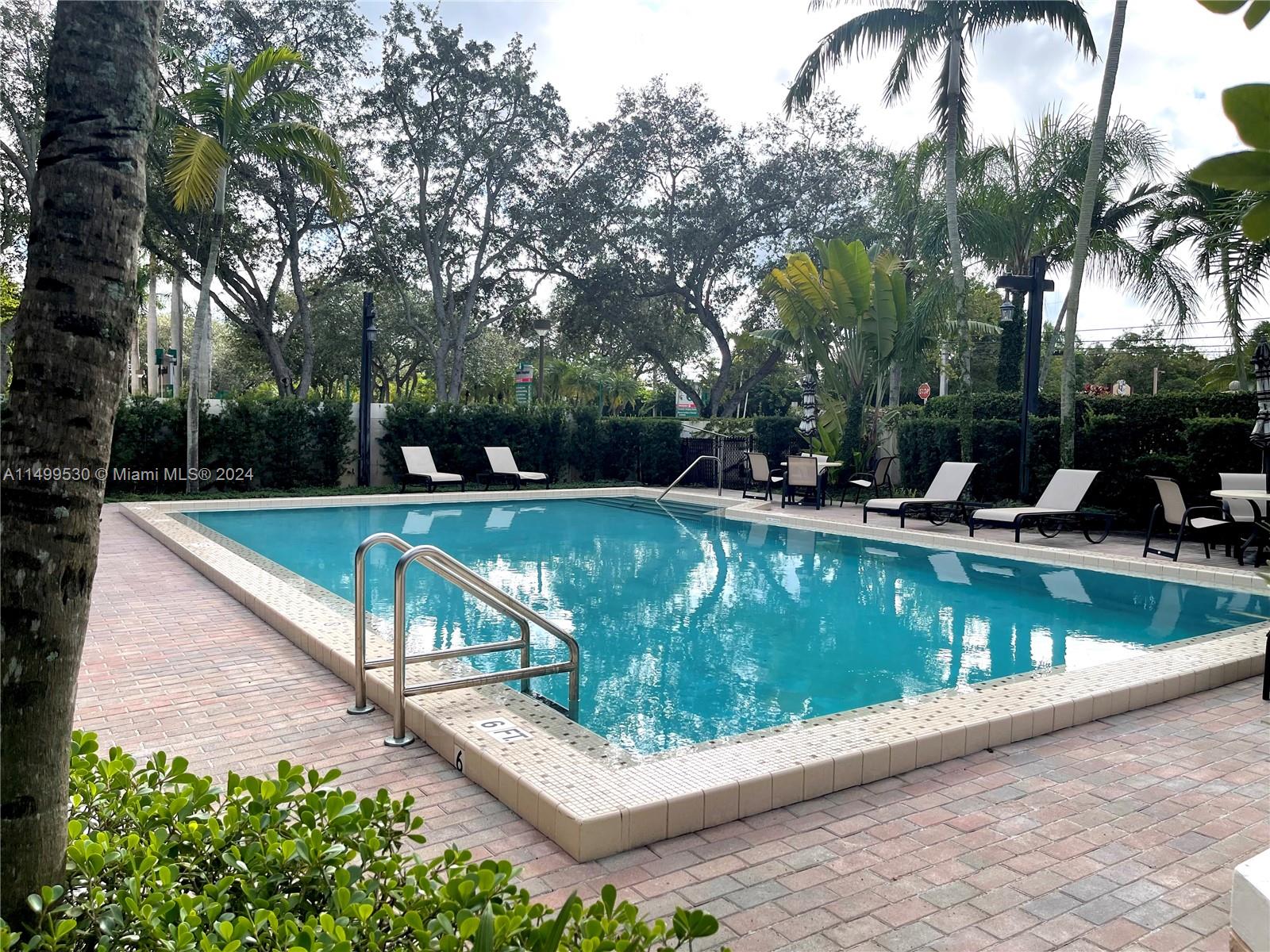 9001 Southwest 94th Street, Unit 201 Miami, FL 33176 - Photo 9 of 10 a view of a house with swimming pool and sitting area