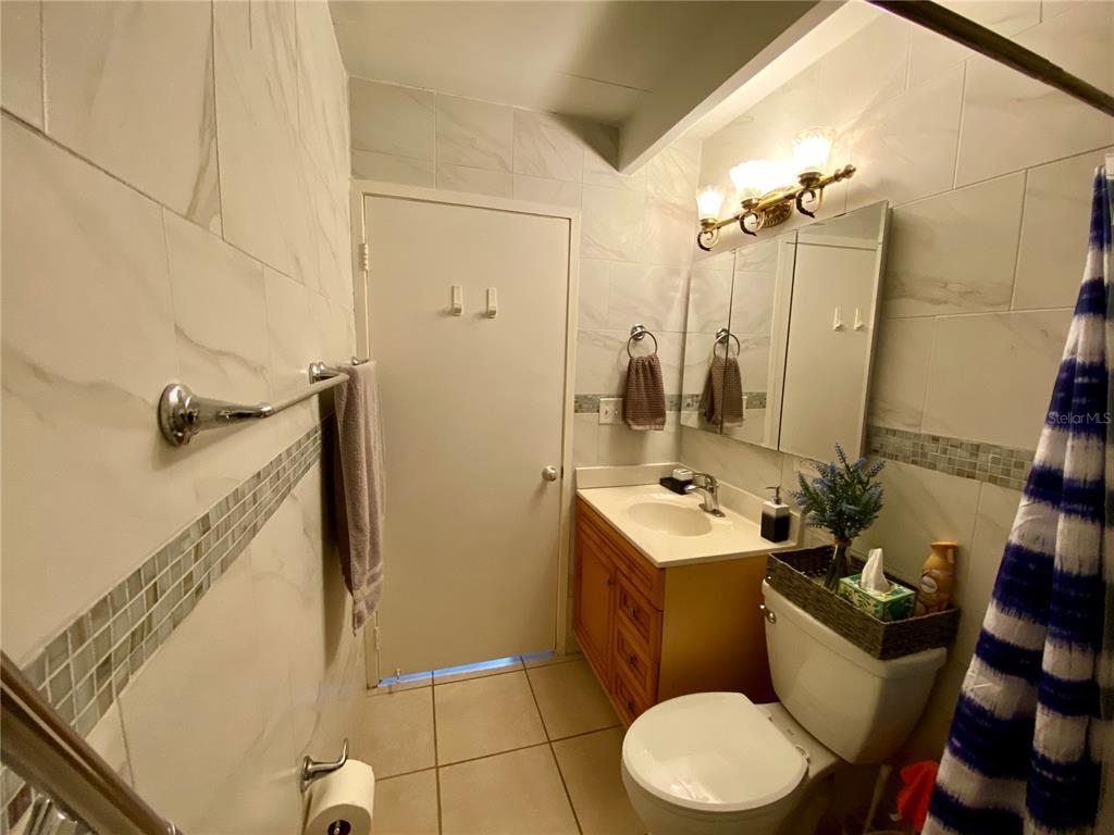 3429 Club Circle Lakeshore, FL 33854 - Photo 11 of 37 a bathroom with a sink toilet and shower