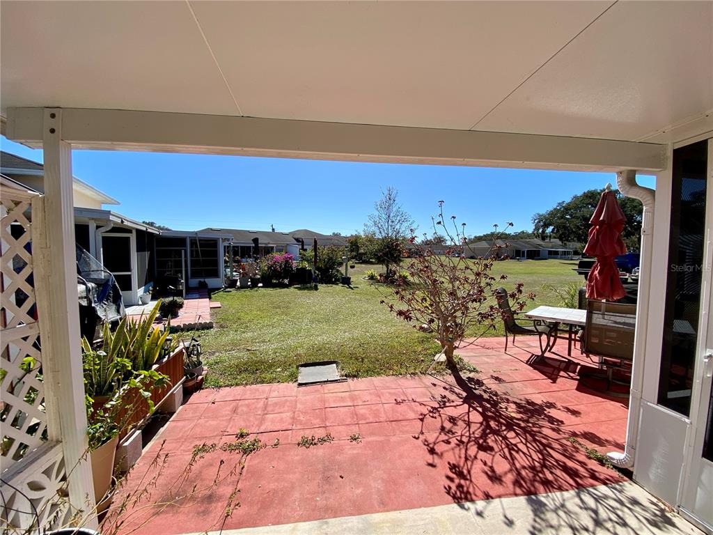 3429 Club Circle Lakeshore, FL 33854 - Photo 19 of 37 a view of a chairs and table in patio