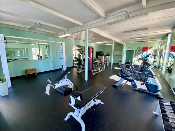 a room with lots of table and chairs