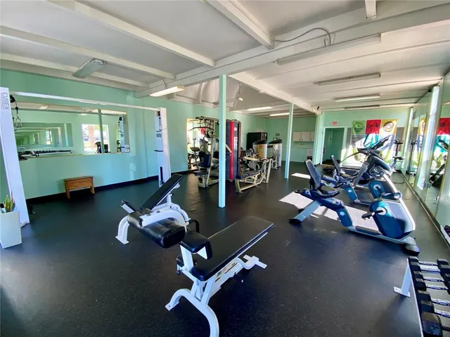 a room with lots of table and chairs