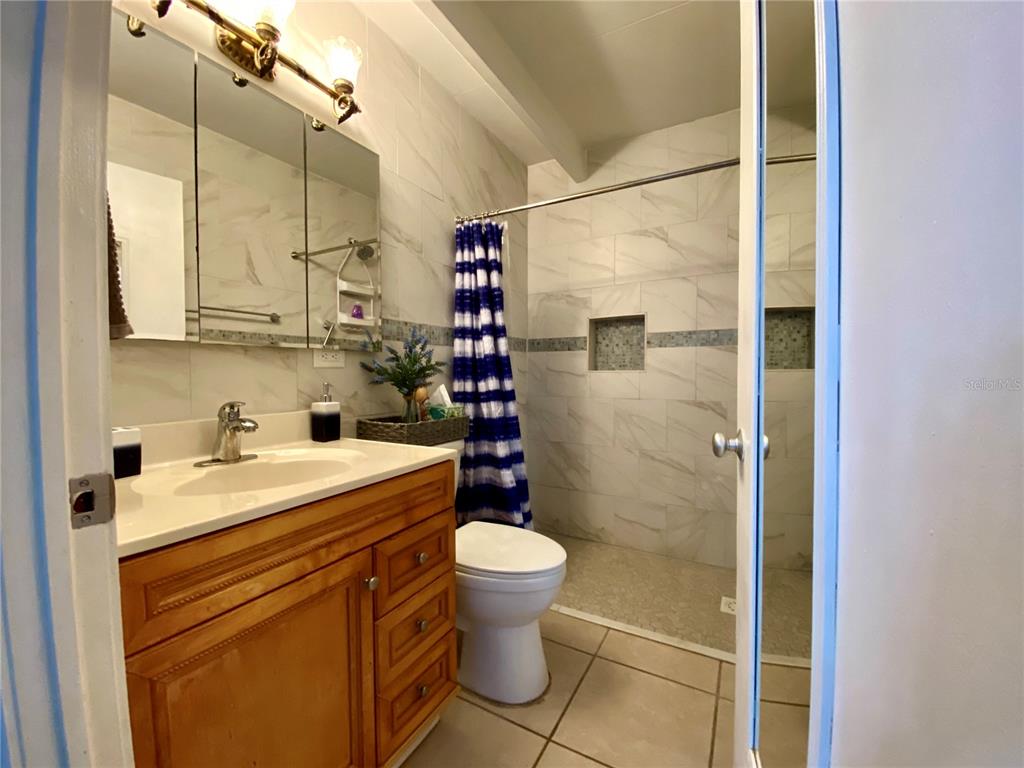 3429 Club Circle Lakeshore, FL 33854 - Photo 10 of 37 a bathroom with a sink toilet and shower