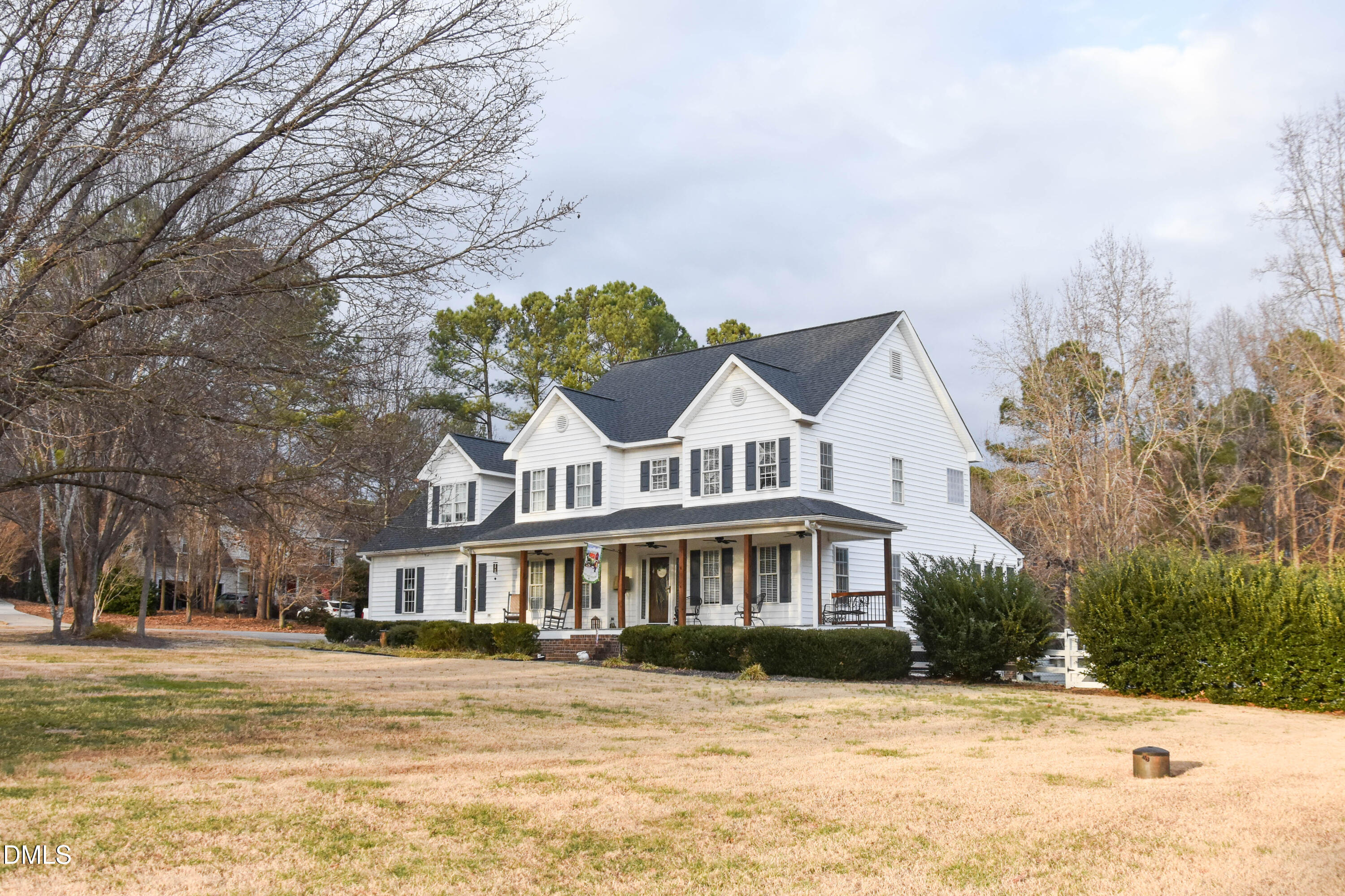 5908 Deep Spring Circle Wake Forest, NC 27587 - Photo 3 of 51 a front view of a house with a yard covered with snow and trees