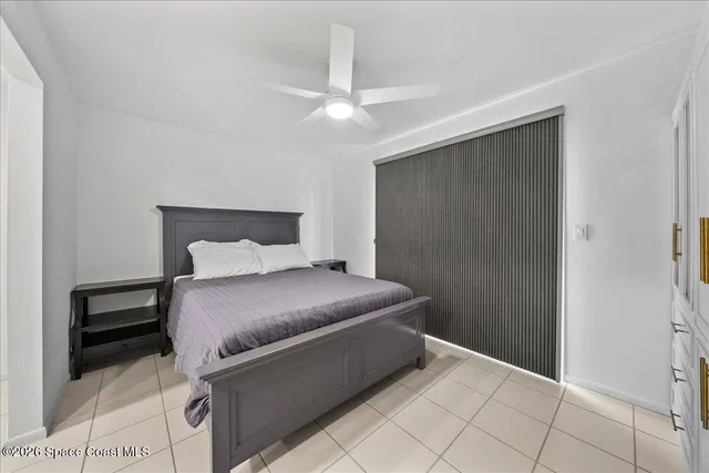 a bedroom with a bed and a cabinets