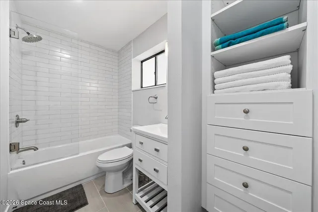 a bathroom with a toilet a sink and bathtub