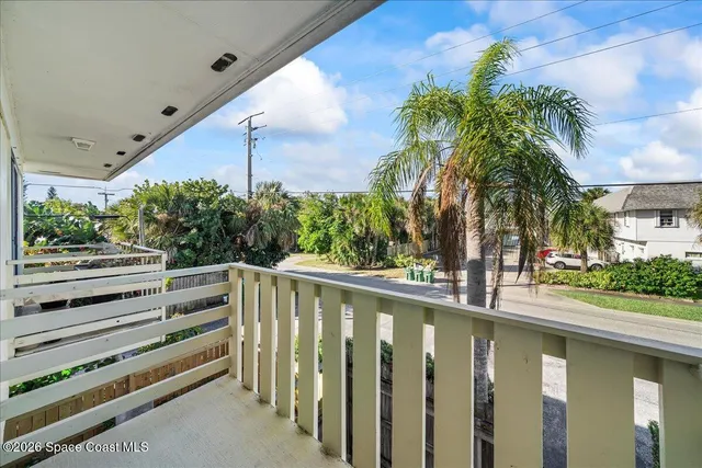 a view of a balcony with plants