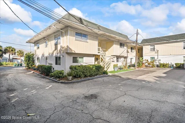 a view of a street with a building in the background