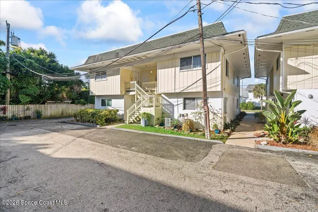 a view of a brick house with a street