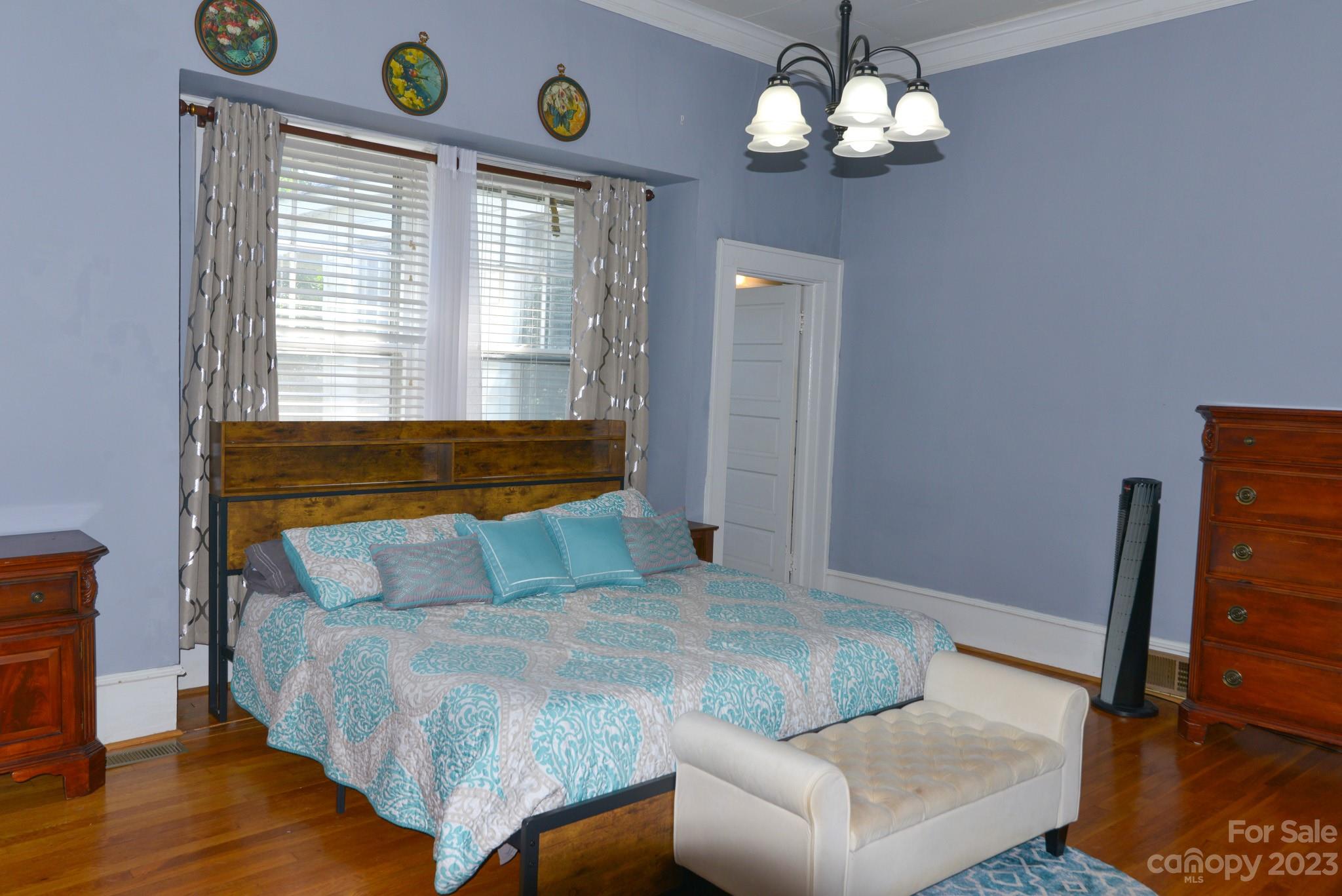 423 North Matson Street Kershaw, SC 29067 - Photo 12 of 33 a bedroom with a bed and wooden floor