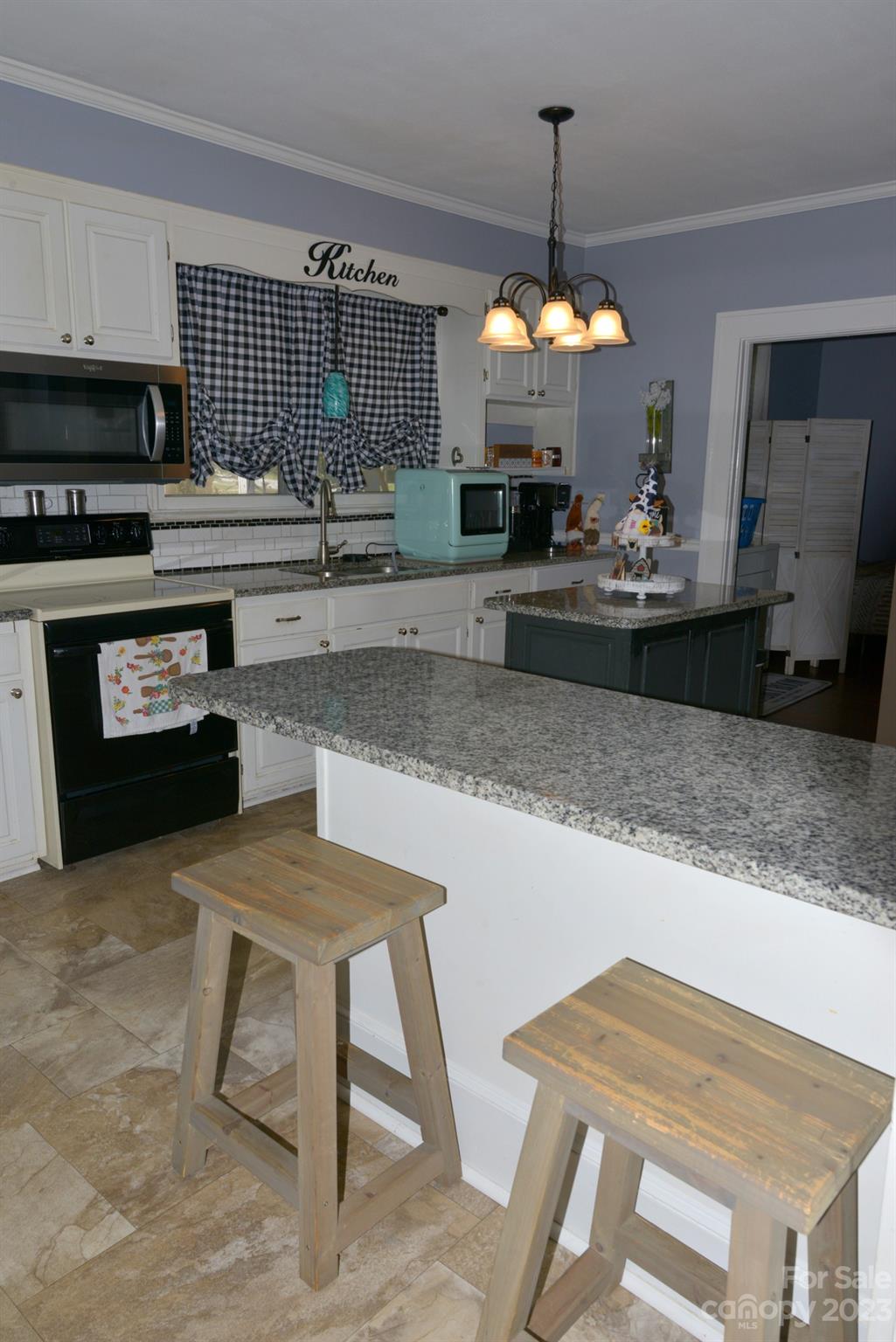 423 North Matson Street Kershaw, SC 29067 - Photo 15 of 33 a kitchen with a table and chairs in it