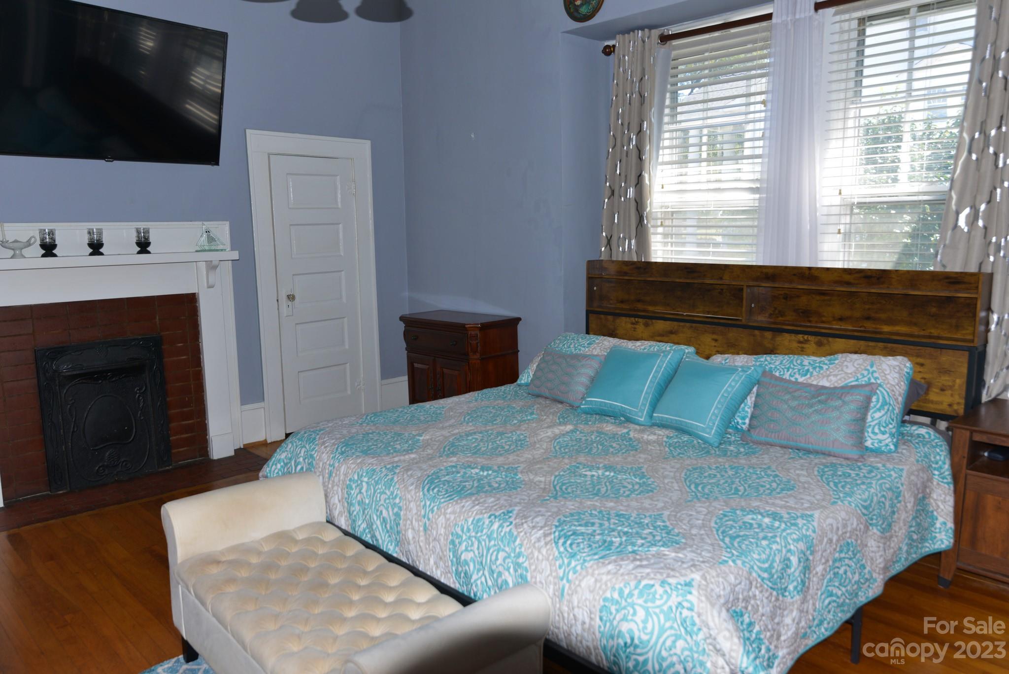 423 North Matson Street Kershaw, SC 29067 - Photo 9 of 33 a bedroom with a bed and a flat screen tv