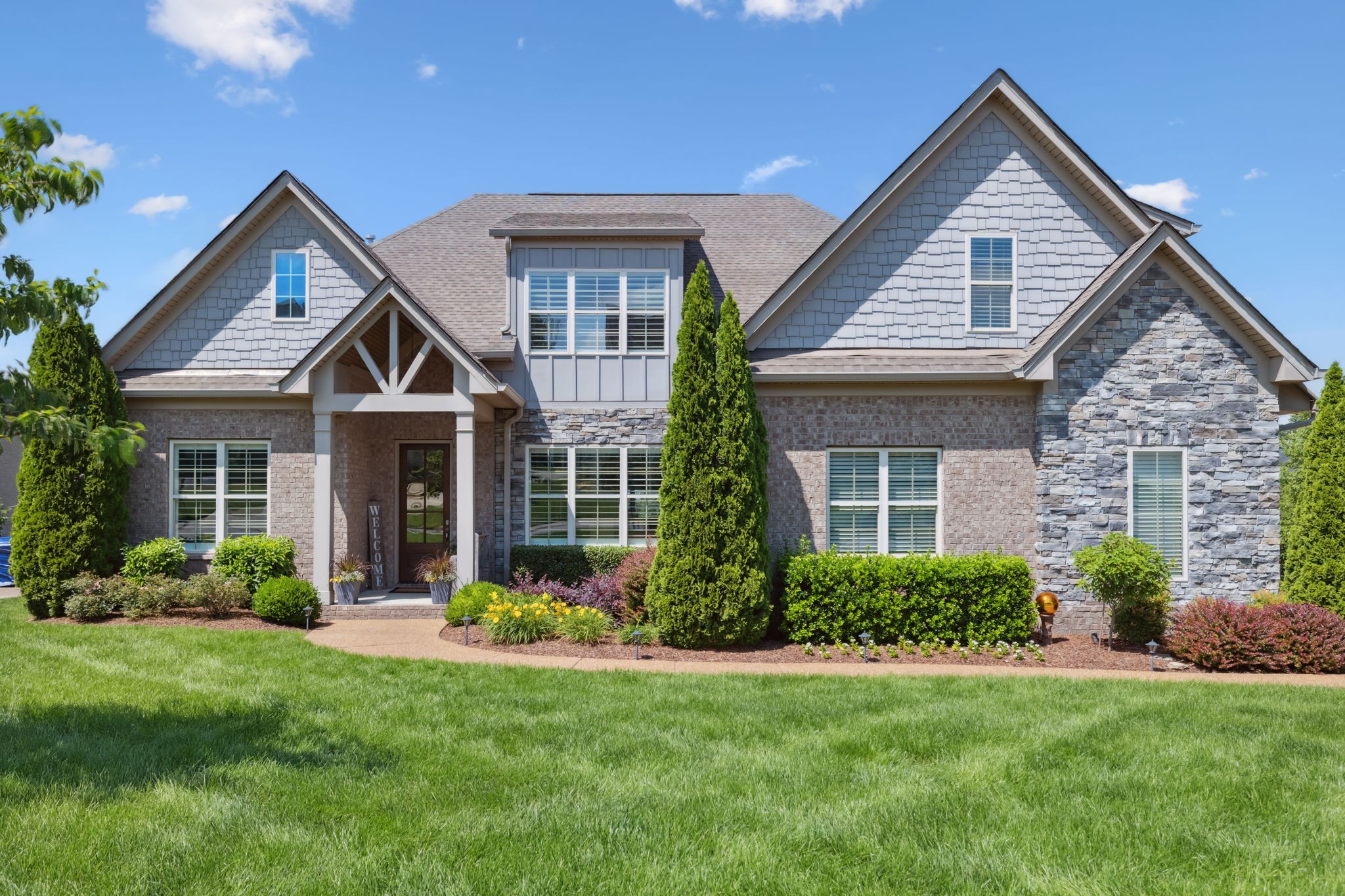 4136 Banner Square Lane Arrington, TN 37014 - Photo 1 of 71 a front view of a house with garden
