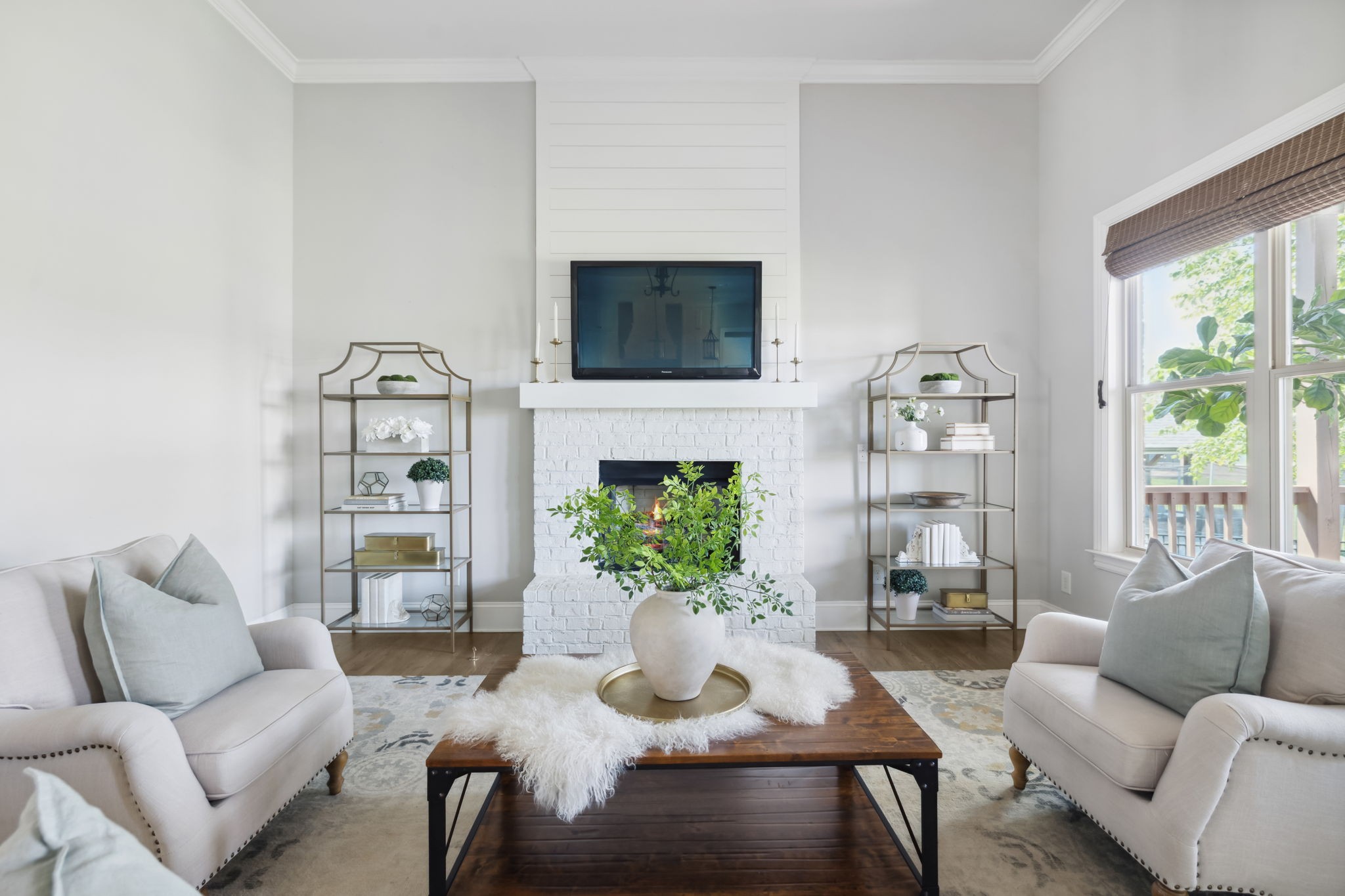 4136 Banner Square Lane Arrington, TN 37014 - Photo 12 of 71 a living room with furniture a flat screen tv and a fireplace