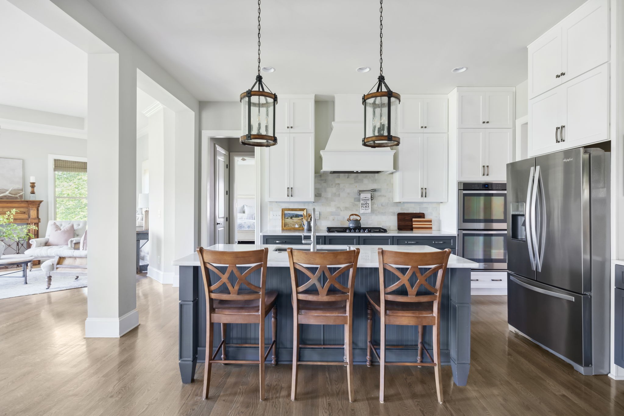 4136 Banner Square Lane Arrington, TN 37014 - Photo 18 of 71 a kitchen with stainless steel appliances a dining table chairs and wooden floor