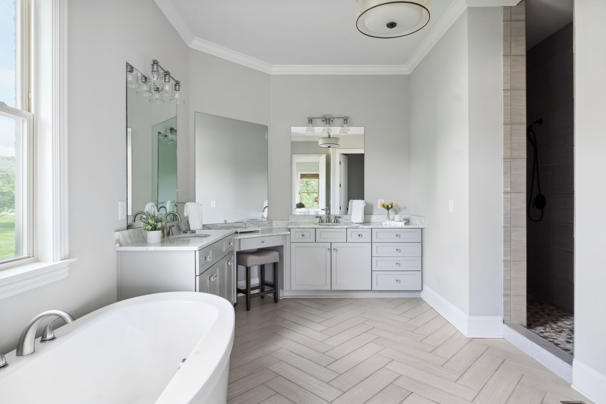 4136 Banner Square Lane Arrington, TN 37014 - Photo 33 of 71 a bathroom with a granite countertop sink mirror and a bathtub