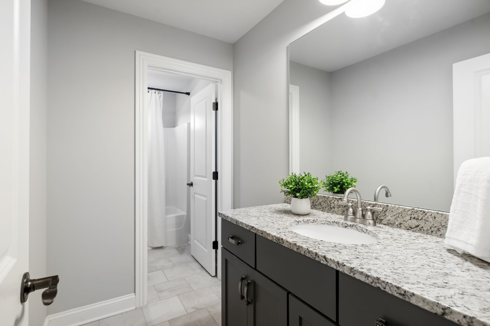 4136 Banner Square Lane Arrington, TN 37014 - Photo 46 of 71 a bathroom with a granite countertop sink and a mirror