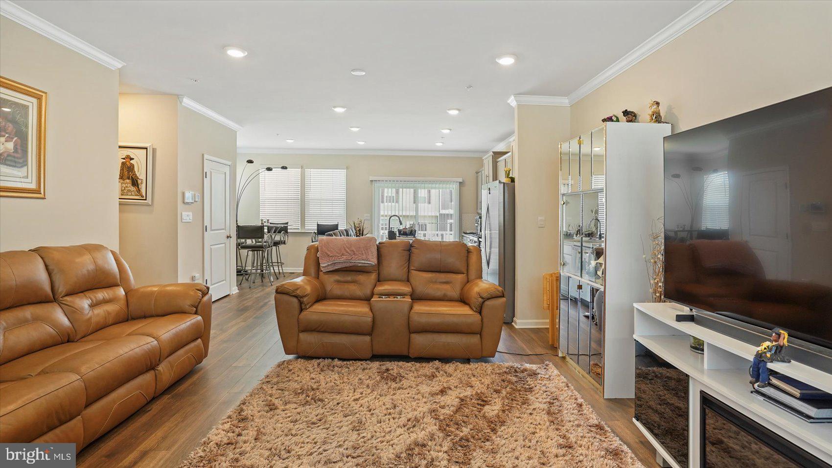 5085 Silver Oak Drive Rosedale, MD 21237 - Photo 19 of 48 a living room with furniture and a flat screen tv