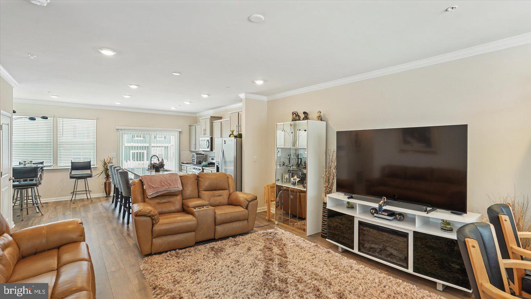5085 Silver Oak Drive Rosedale, MD 21237 - Photo 20 of 48 a living room with furniture and a flat screen tv