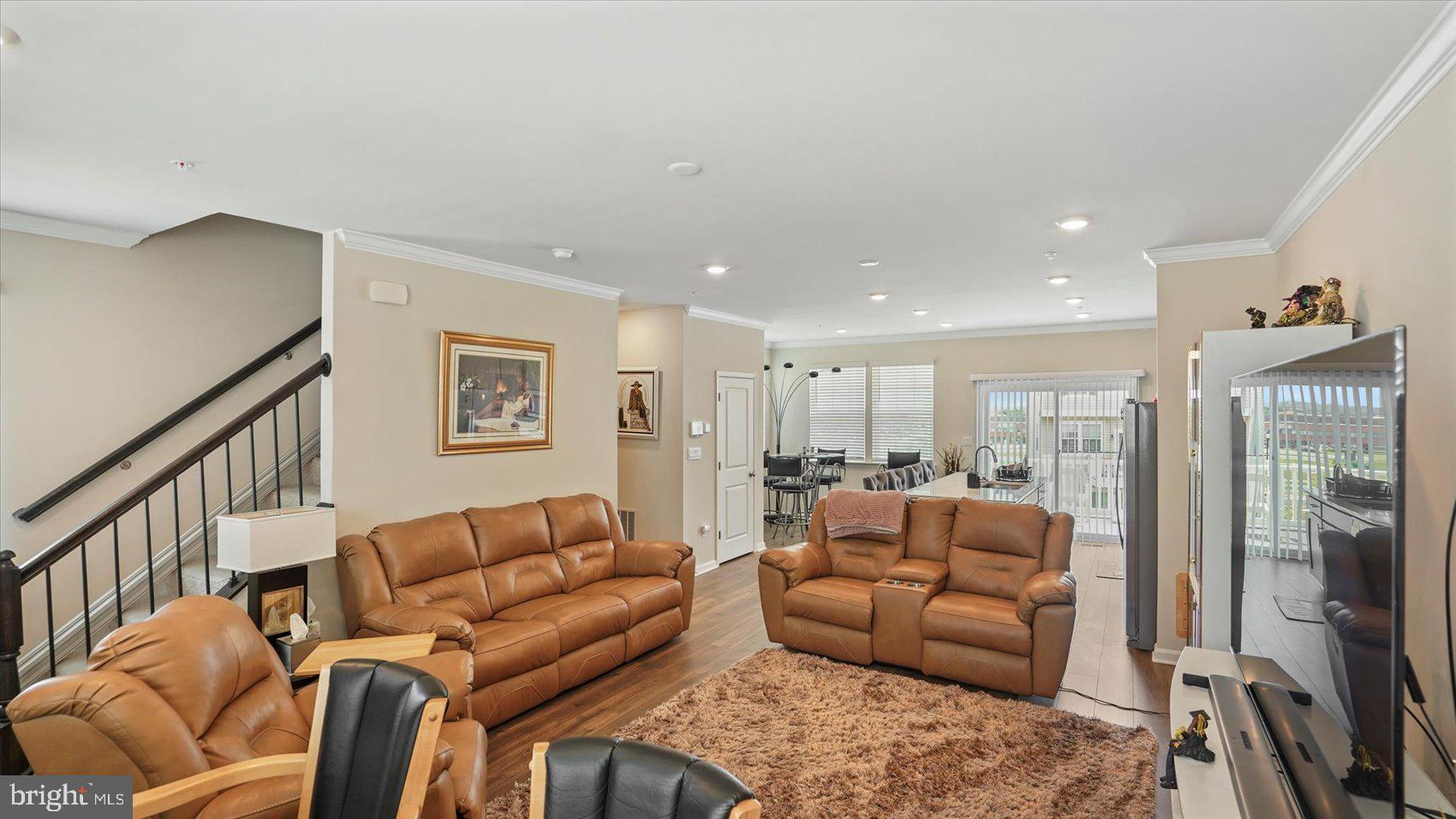5085 Silver Oak Drive Rosedale, MD 21237 - Photo 21 of 48 a living room with furniture a flat screen tv and a large window