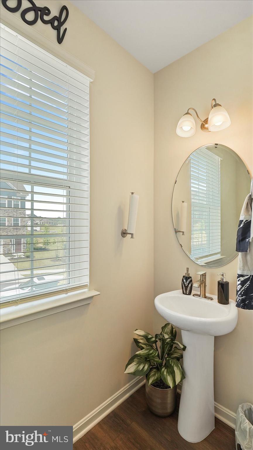 5085 Silver Oak Drive Rosedale, MD 21237 - Photo 23 of 48 a bathroom with a sink a mirror and a window