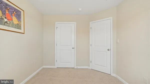 a view of hallway with painting on the wall