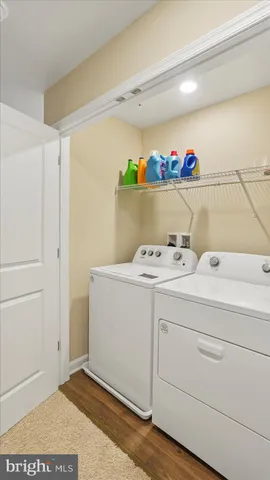 a view of storage and utility room with washer and dryer