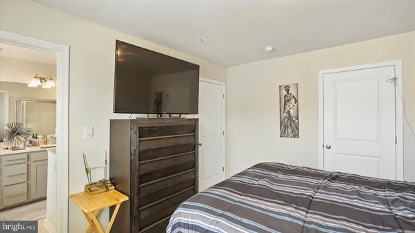 a bedroom with a bed and furniture