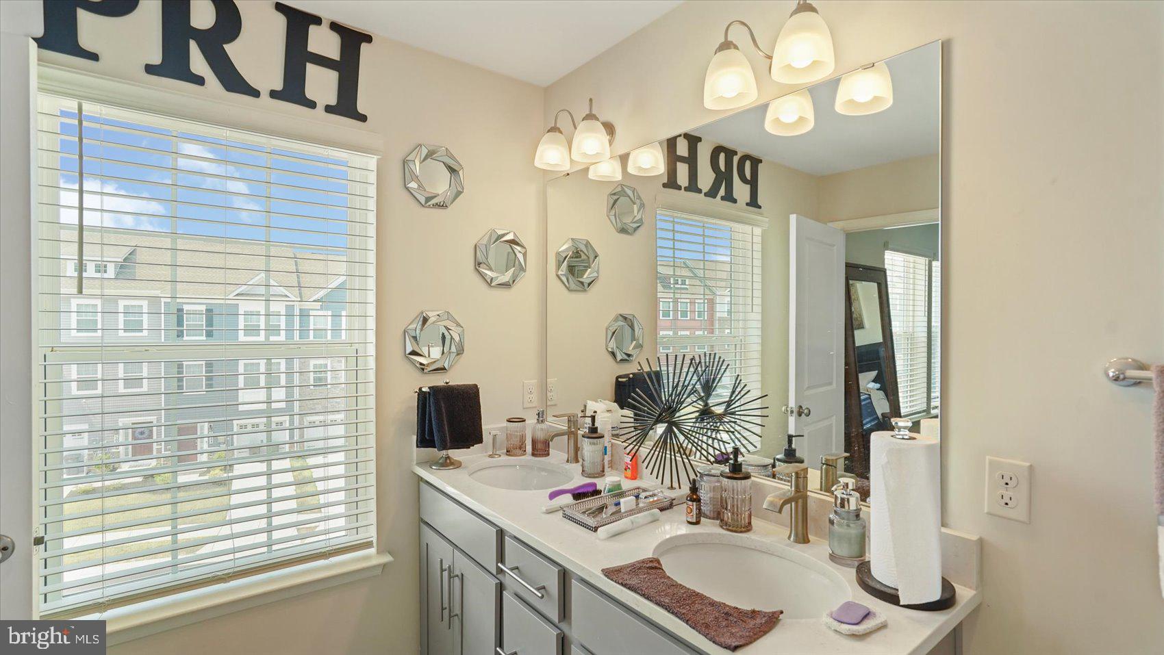 5085 Silver Oak Drive Rosedale, MD 21237 - Photo 34 of 48 a bathroom with a sink vanity granite and a mirror
